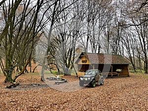 4x4 car with mud in a middle of the autumn forest