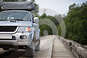 4x4 car on wooden bridge