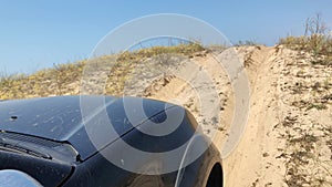 4x4 climbing up the side of a massive sand dune cliff desert trail, Dove Springs OHV off road recreational vehicle area