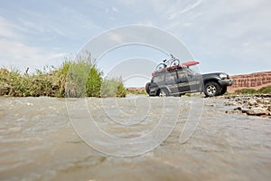 4X4 off road vehicle crossing river