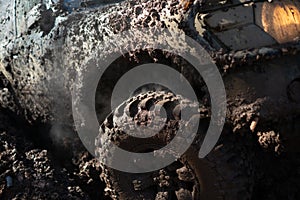 4x4 off-roading. Wheel close up in a countryside landscape with a muddy road. Offroad. Closeup photo of car wheel. 4x4