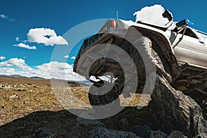 4x4 offroad car on big rock