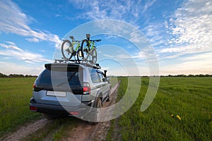 4x4 SUV with two bicycles on roof rack