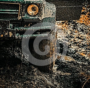 4x4 travel trekking. Offroad vehicle coming out of a mud hole hazard. Off-road travel on mountain road. Expedition