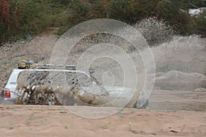 4x4 vehicle driving through Limpopo riverbed.