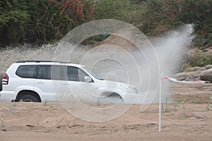 4x4 vehicle driving through Limpopo riverbed.