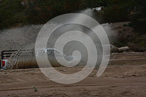 4x4 vehicle driving through Limpopo riverbed.