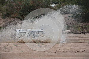 4x4 vehicle driving through Limpopo riverbed.