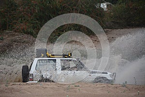 4x4 vehicle driving through Limpopo riverbed.