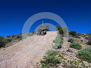 4x4 Vehicle Driving on Steep Dirt Road in Arizona