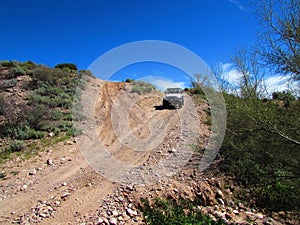 4x4 Vehicle Driving on Steep Dirt Road in Arizona