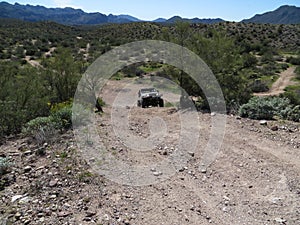 4x4 Vehicle Driving on Steep Dirt Road in Arizona
