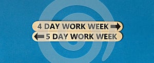 5 or 4 day week symbol. Concept word 5 day work week or 4 day work week on beautiful wooden stick. Beautiful blue table blue