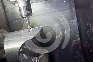 The 5 axis CNC machine cutting the automotive part