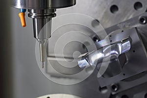 The 5-axis CNC machine cutting the sample part.