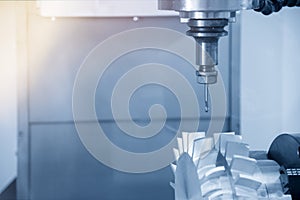 The 5-axis CNC machine cutting the sample part