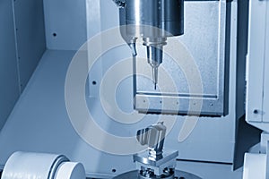 The 5-axis CNC machine cutting the sample part.