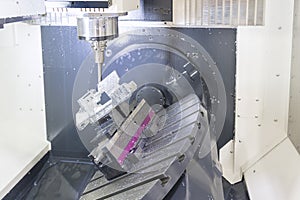 The 5-axis CNC machine while cutting the sample part