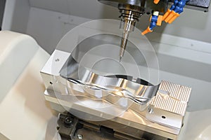 The 5 axis CNC milling machine cutting the automotive mold parts with solid ball endmill tools.