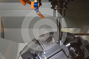 The 5-axis CNC milling machine cutting the automotive part with solid ball end mill tool