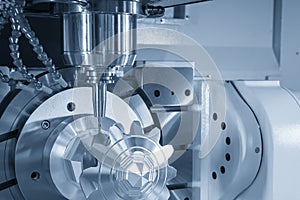 The 5-axis machining center cutting the metal gear part with solid ball endmill tool.