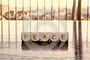 5 dices forming the Word `peace`