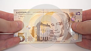 5 Georgian lari in hands, georgian money, bank of georgia