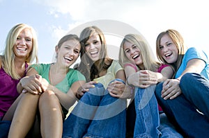 5 Girls sitting together and laughing