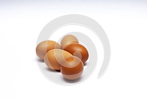 5 hen`s eggs in a white background