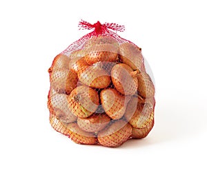 5 kg farm onions in a red pp mesh bag isolated on white background. Polypropylene net sack with 11 lb of organic onions. Buying