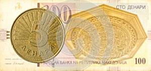 5 macedonian denar coin against 100 macedonian denar bank note