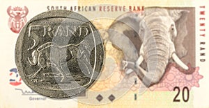 5 rand coin against 20 south african rand bank note obverse