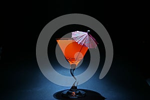5 second time laps aka Bulb exposure of orange liquid in a martini glass photo