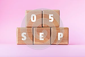 5 SEP text on wood cubes. 5th September. Holiday date. International Day of Charity.