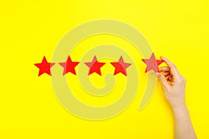 5 stars increase rating, customer experience concept. Hand of client show putting 5 star symbol to increase Service rating. five