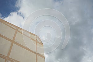 5-storey reinforced concrete building and sky backdrop