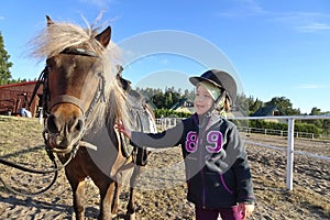 5 years old girl with a pony