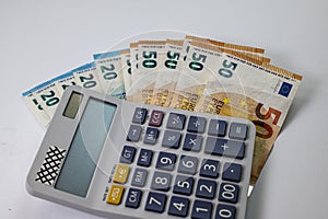 50 and 20 euro banknotes with calculator