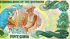 50 Cents banknote, Bank of Bahamas, closeup bill fragment shows Woman, Sister Sarah in the Nassau Market