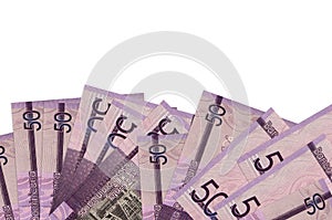 50 Dominican pesos bills lies on bottom side of screen isolated on white background with copy space. Background banner template