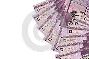 50 Dominican pesos bills lies isolated on white background with copy space. Rich life conceptual background