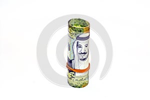 50 Fifty Saudi Arabia money roll riyals banknotes isolated on white background, Saudi riyals cash money bills rolled up with
