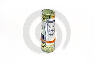 50 Fifty Saudi Arabia money roll riyals banknotes isolated on white background, Saudi riyals cash money bills rolled up