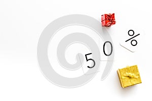 50% off discount - sale concept with present box - on white background top-down copy space