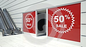 50 percent sale on shopfront windows and escalator photo