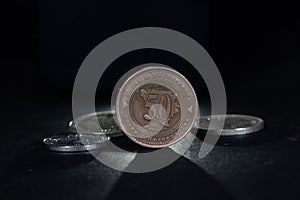 50 Pfening coin with the mention 50 feininga in bosnian, isolated on a black background. it\'s the division of BAM, or Bosnia