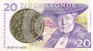 50 swedish oere coin against 20 swedish krona bank note