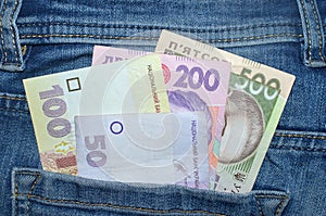 500, 200,100, 50 bills hryvnia in the back pocket of blue jeans. macro