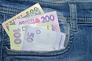 500, 200,100, 50 bills hryvnia  in the front pocket of blue jeans.