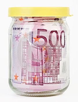 500 Euro bank notes in a glass jar